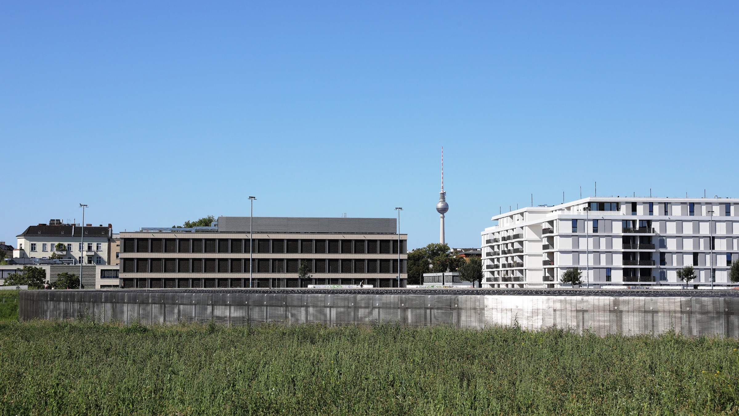The low circular roof and landscaped setting of Dominique Perrault’s Berlin Velodrome in 2024