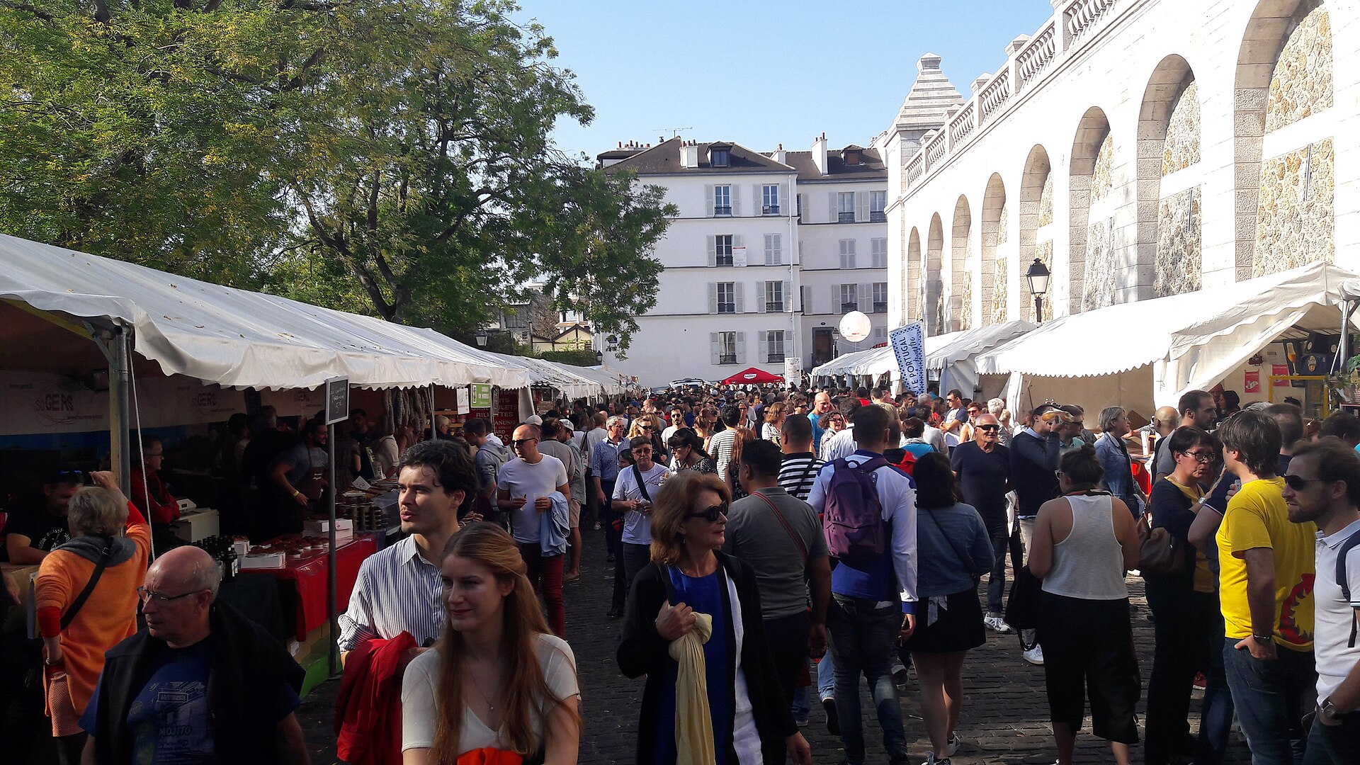 Crowds and food stalls at the real Fete des Vendanges de Montmartre in Paris