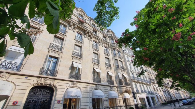 French real estate and long-term value on Avenue Montaigne Historic stone residential building at 45 Avenue Montaigne in Paris, photographed in a wide 16:9 view