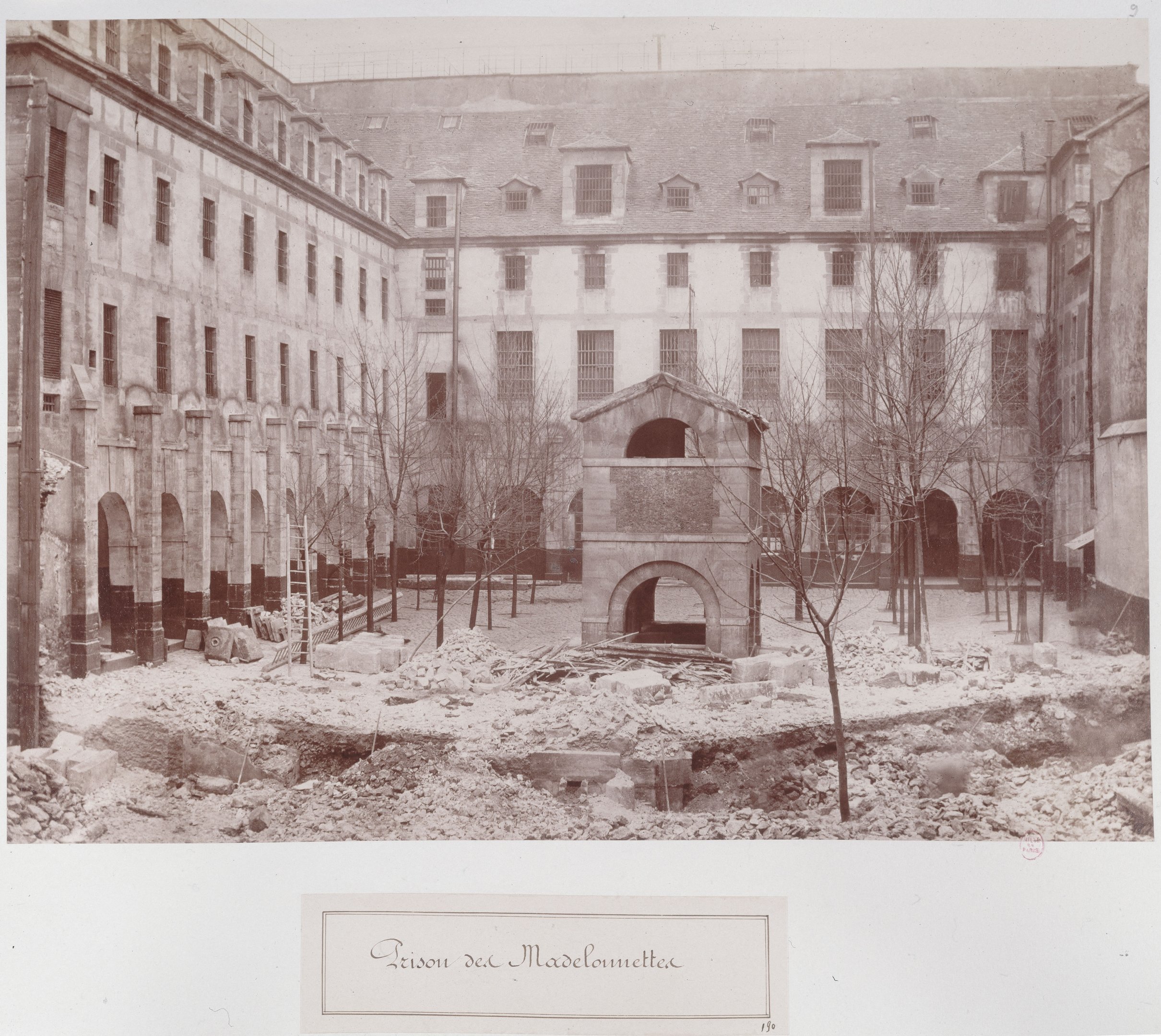 Rubble and partially demolished buildings at the Madelonnettes prison in Paris in 1868