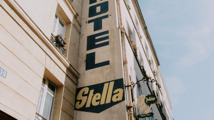 Hotel Stella vintage sign on a Paris boutique hotel façade