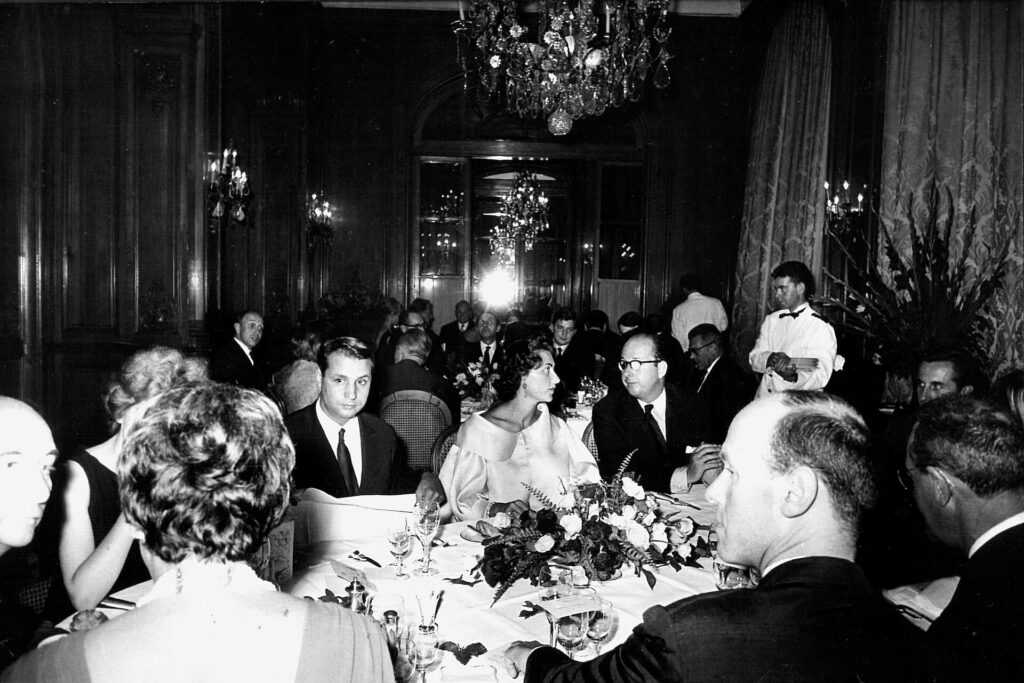 Fashion journalist Marie-Jacques Perrier at a Plaza Athénée dinner in 1962