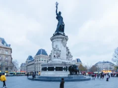 City of Freedom: Where Does Individual Freedom End and the Rights of the City Begin? People crossing Place de la République in Paris beneath the Monument to the Republic