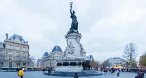 City of Freedom: Where Does Individual Freedom End and the Rights of the City Begin? People crossing Place de la République in Paris beneath the Monument to the Republic