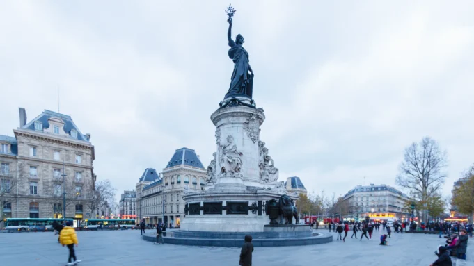Place de la République and Paris public space People crossing Place de la République in Paris beneath the Monument to the Republic