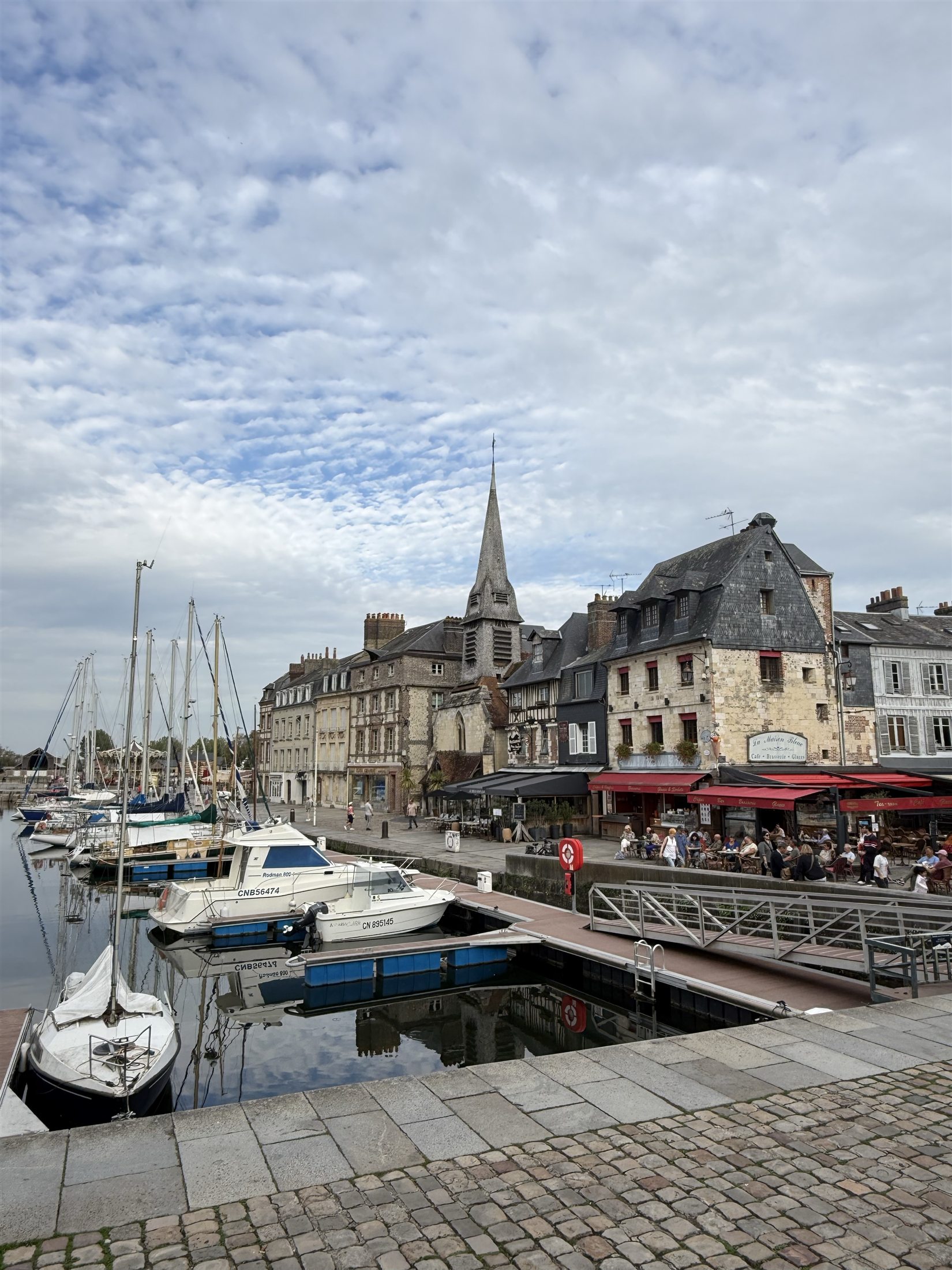 Historic waterfront houses and boats in Honfleur Normandy