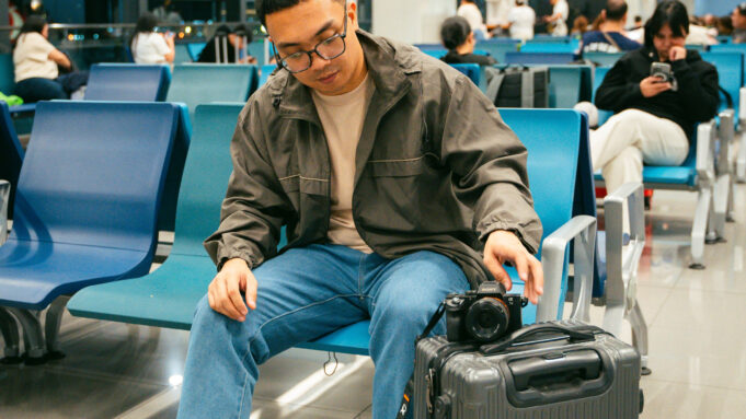 Paris airport hotel planning for an early flight Traveller waiting in a modern airport terminal with luggage