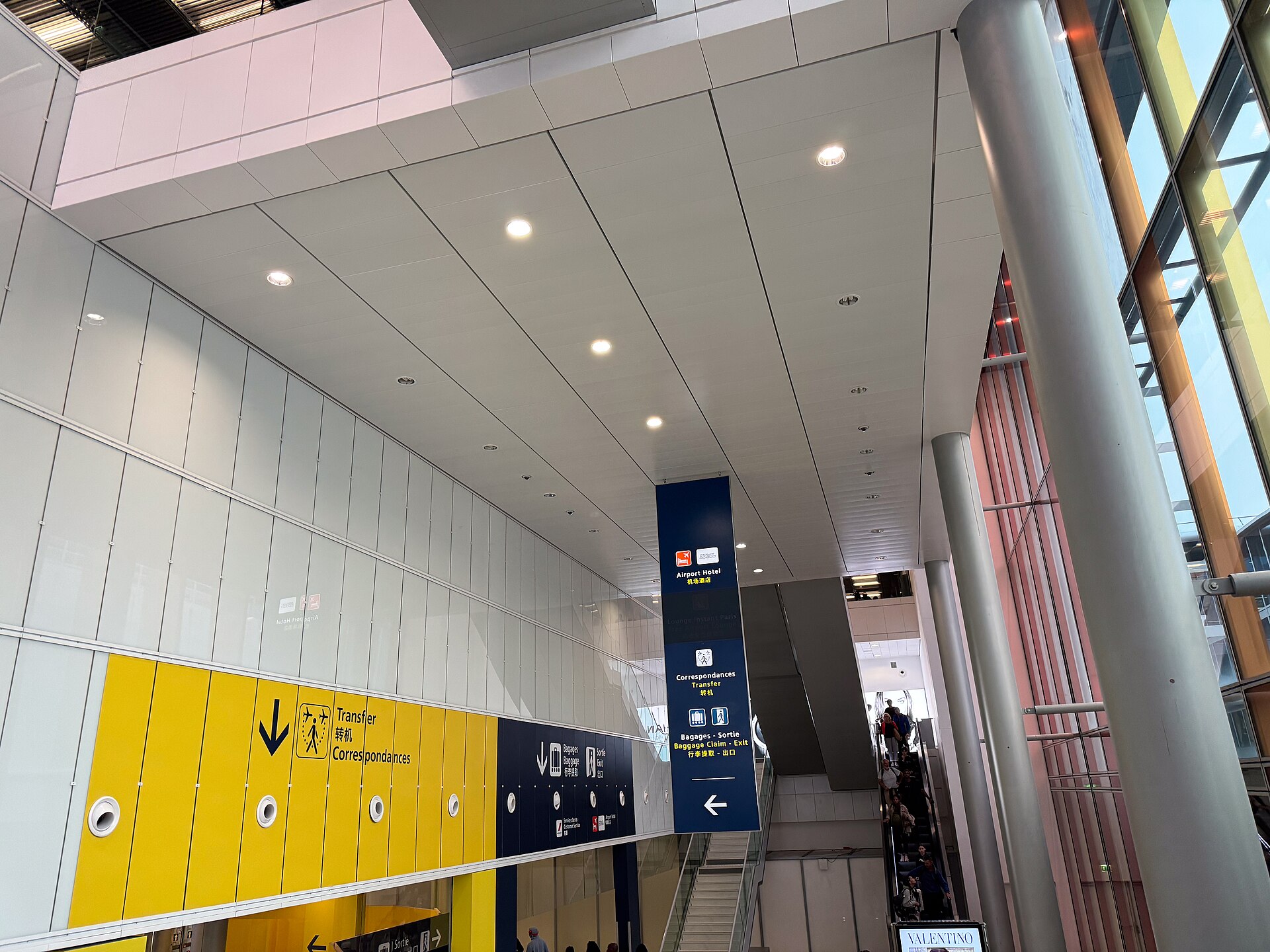 Real multilingual wayfinding signs at a Paris airport