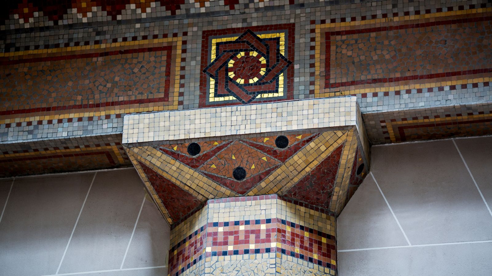 Original red and gold Art Deco mosaic detail at Prince de Galles Paris
