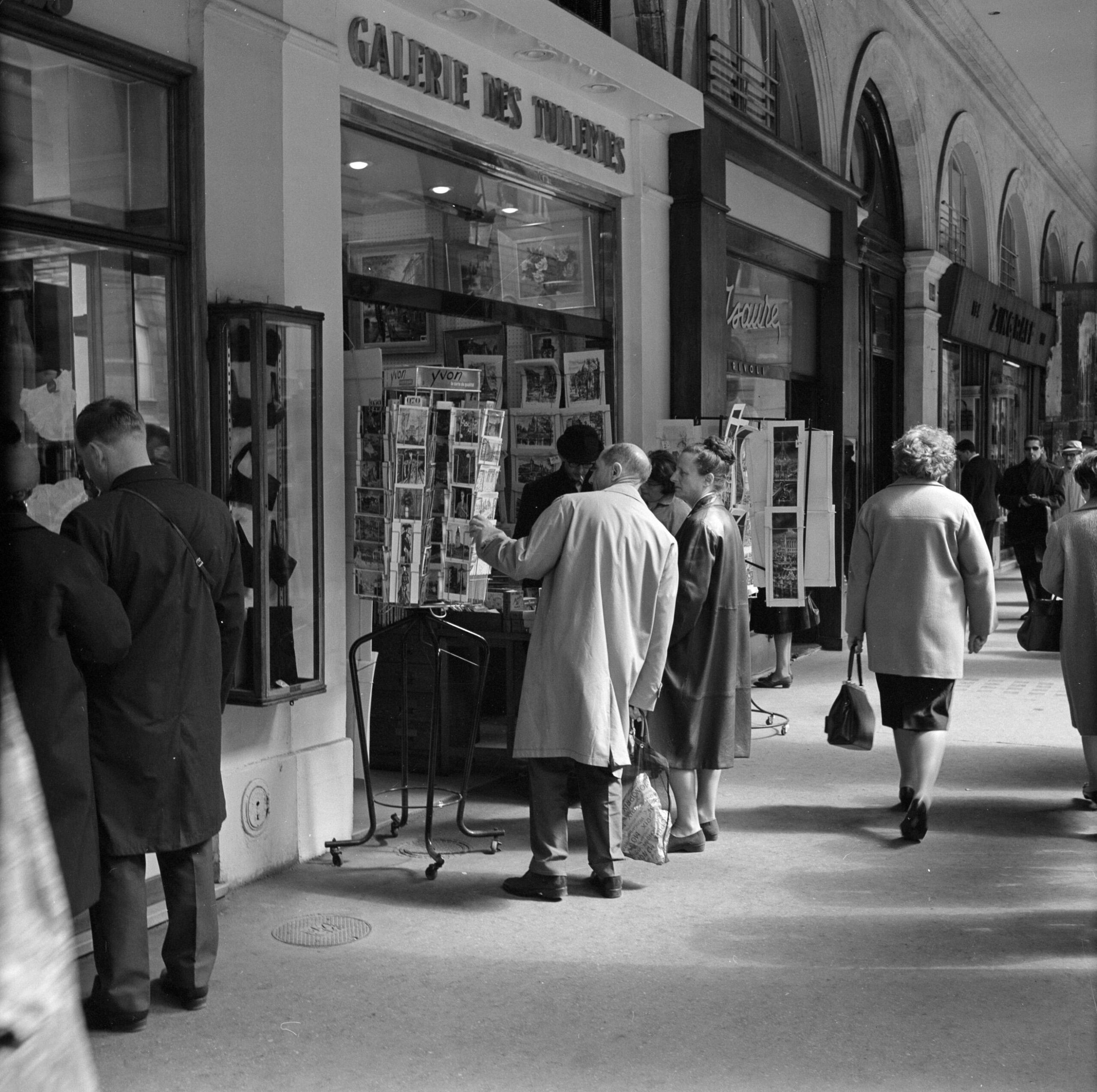 Women and men shopping beneath the Rue de Rivoli arcades in Paris in 1965