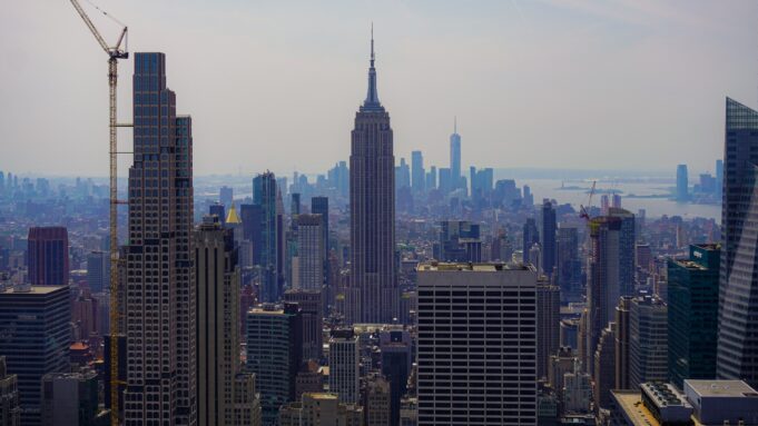 New York skyline with the Empire State Building — USA: Owning Property or a Business Is Not the Same as Earning Immigration Status