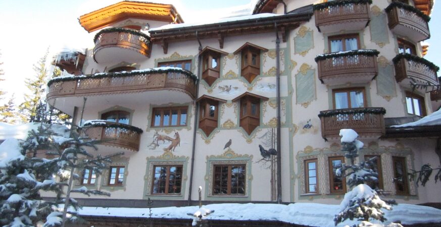 Decorated Alpine façade of Les Airelles Courchevel beneath snow