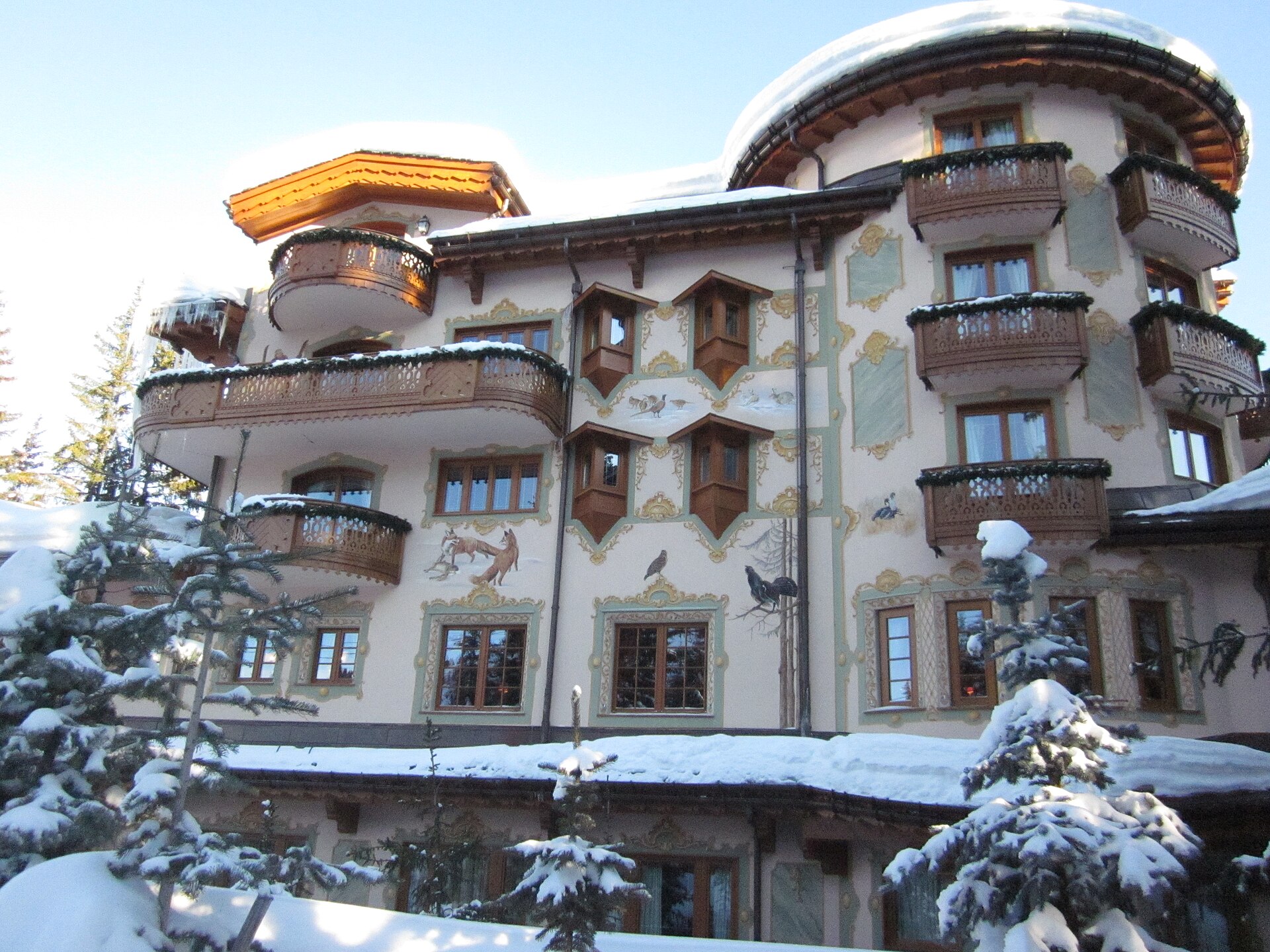 Decorated Alpine façade of Les Airelles Courchevel beneath snow