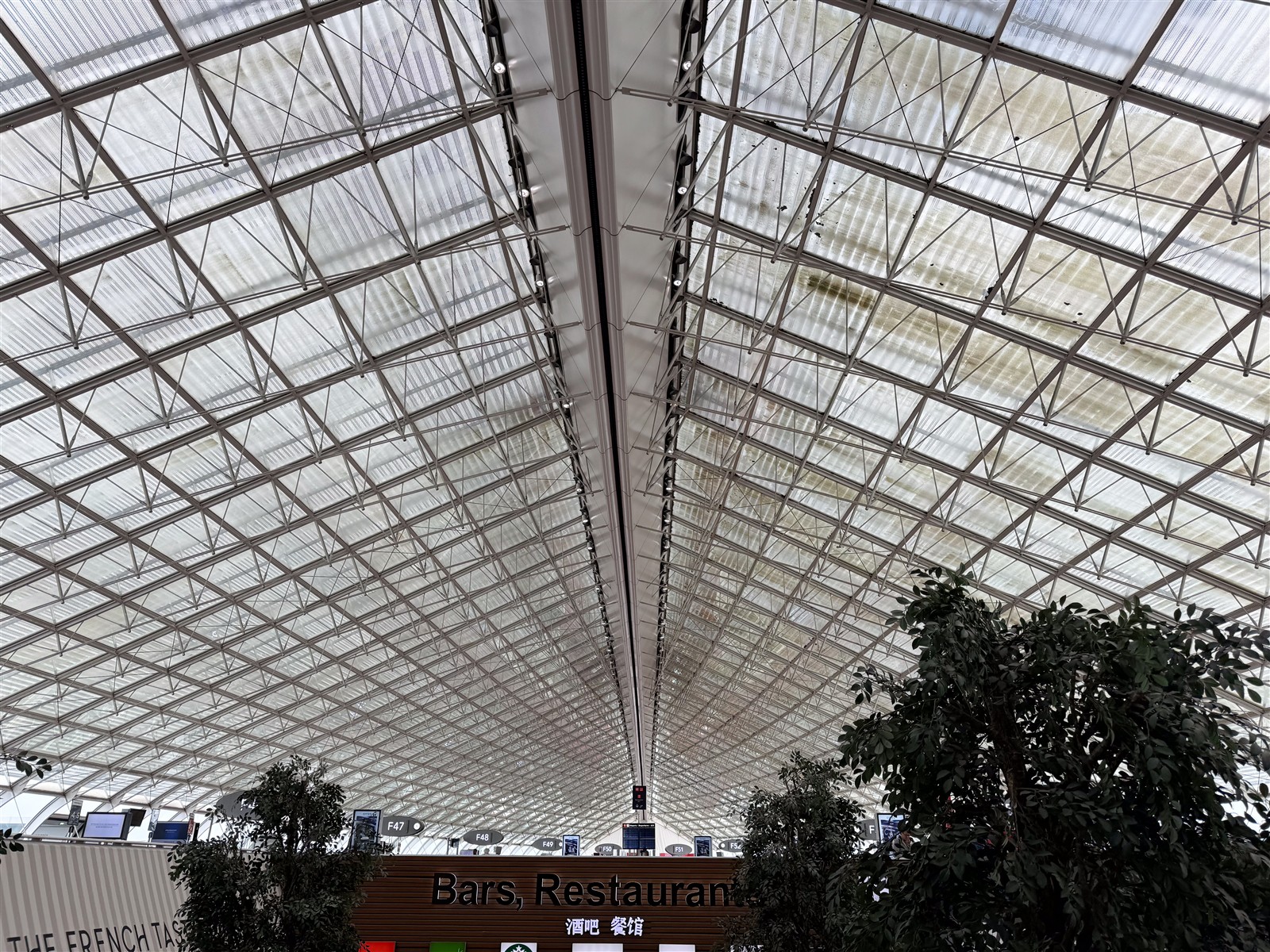 Sweeping glass roof of Paris Charles de Gaulle Terminal 2F, photographed by Tony Webster in July 2024