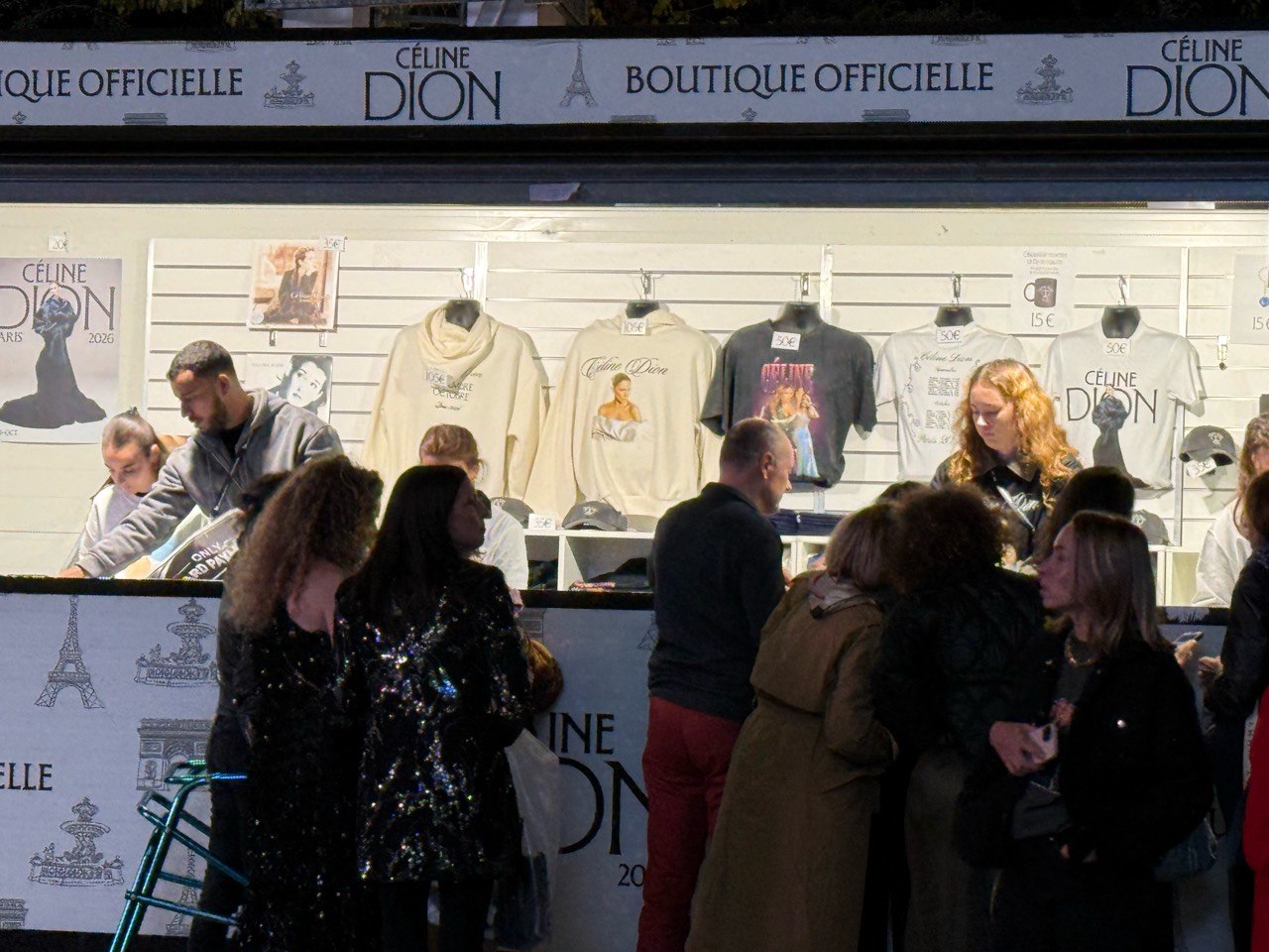 Official Céline Dion merchandise stand after the Paris 2026 concert