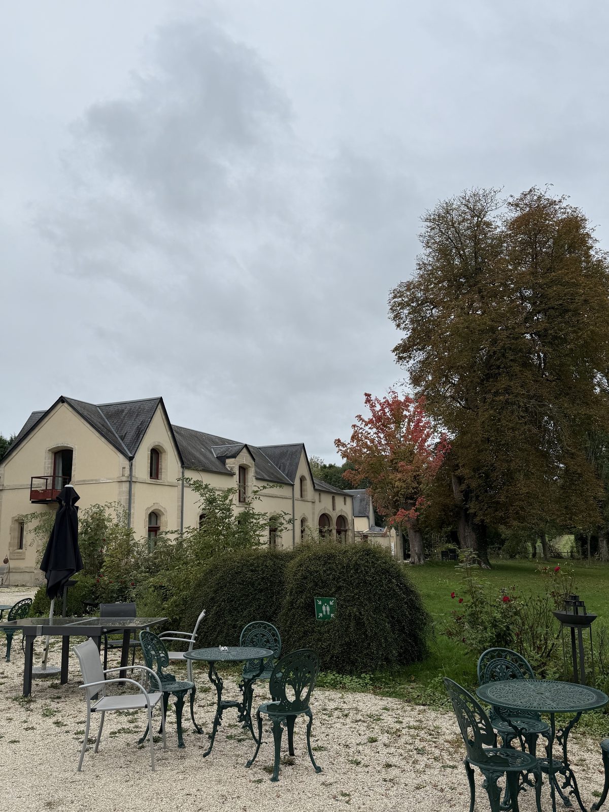 Historic annex and courtyard seating at Château de Bellefontaine
