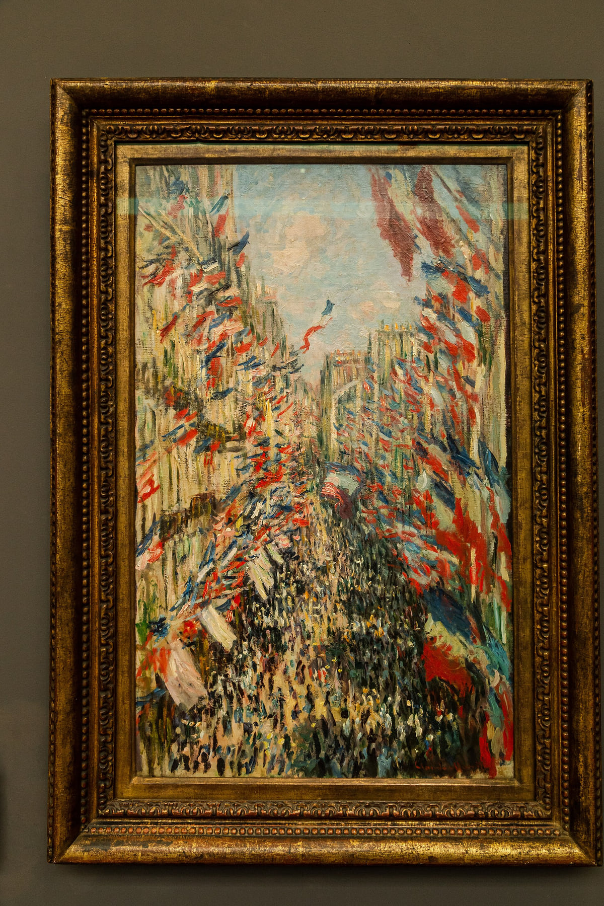 Tableau de Claude Monet montrant la rue Montorgueil couverte de drapeaux français le 30 juin 1878.