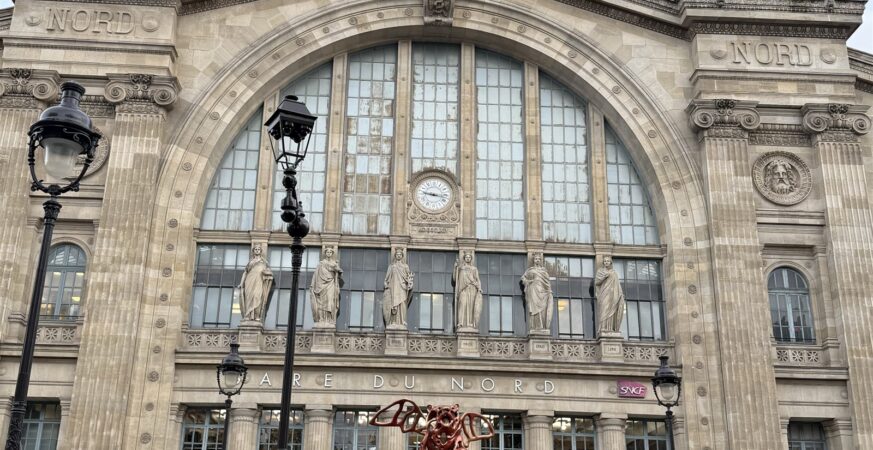 Main façade clock and statues of Paris Gare du Nord