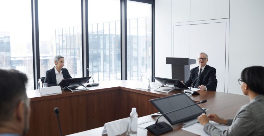 Business meeting in a conference room with large windows