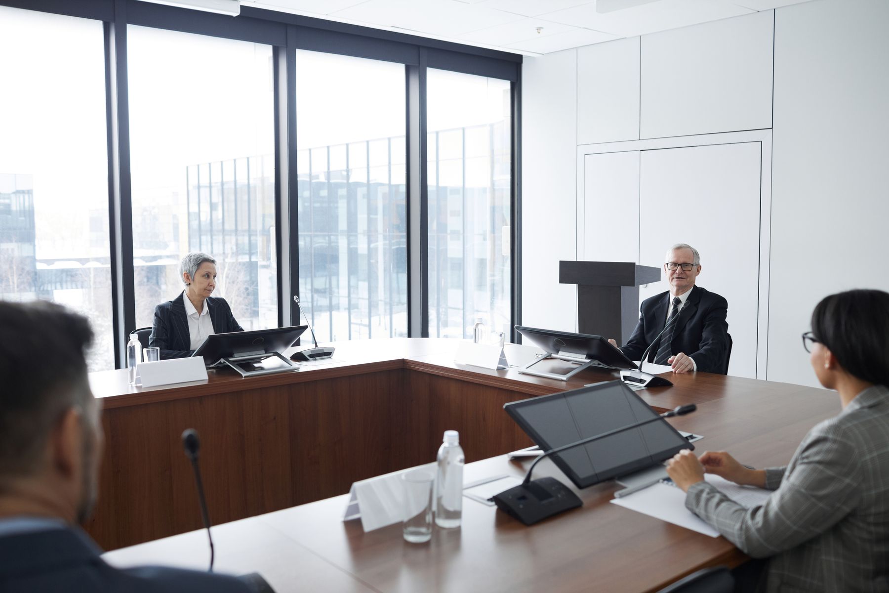 Business meeting in a conference room with large windows