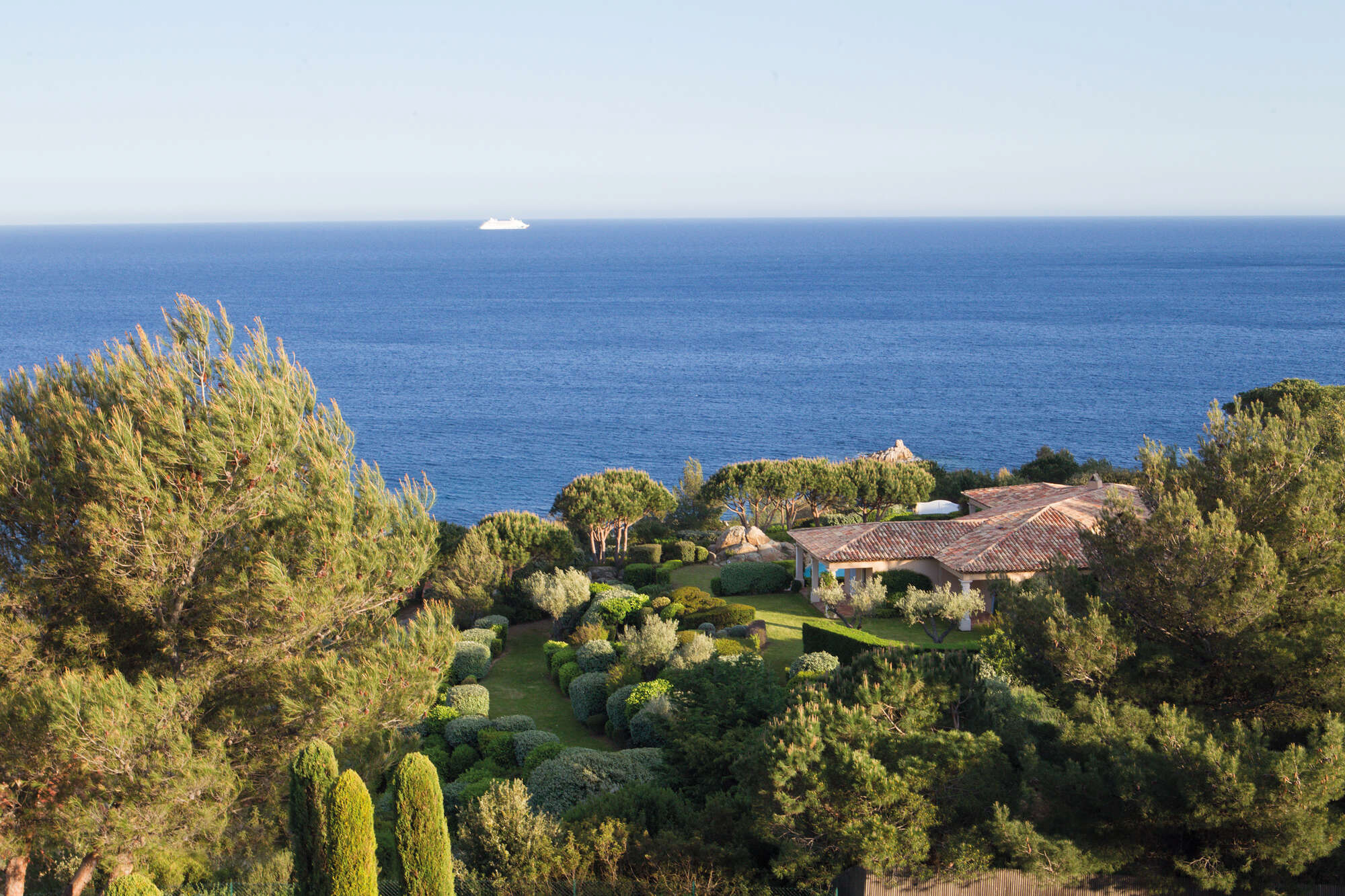 Mediterranean view over a villa and gardens at La Réserve Ramatuelle