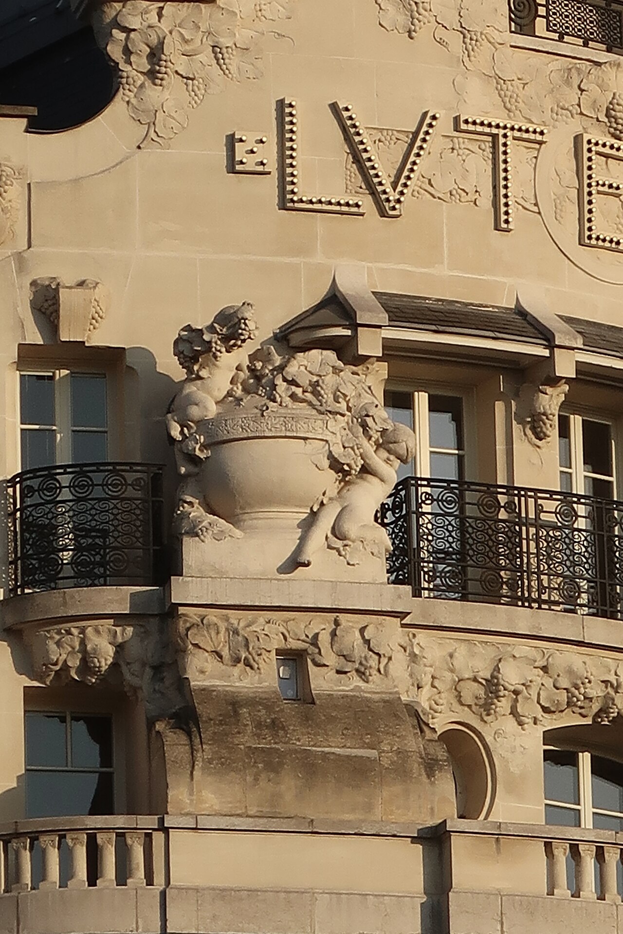 Sculpted façade detail and Lutetia lettering at the hotel on boulevard Raspail