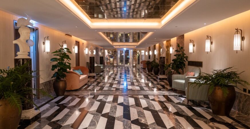 An elegant hotel lobby with marble flooring.