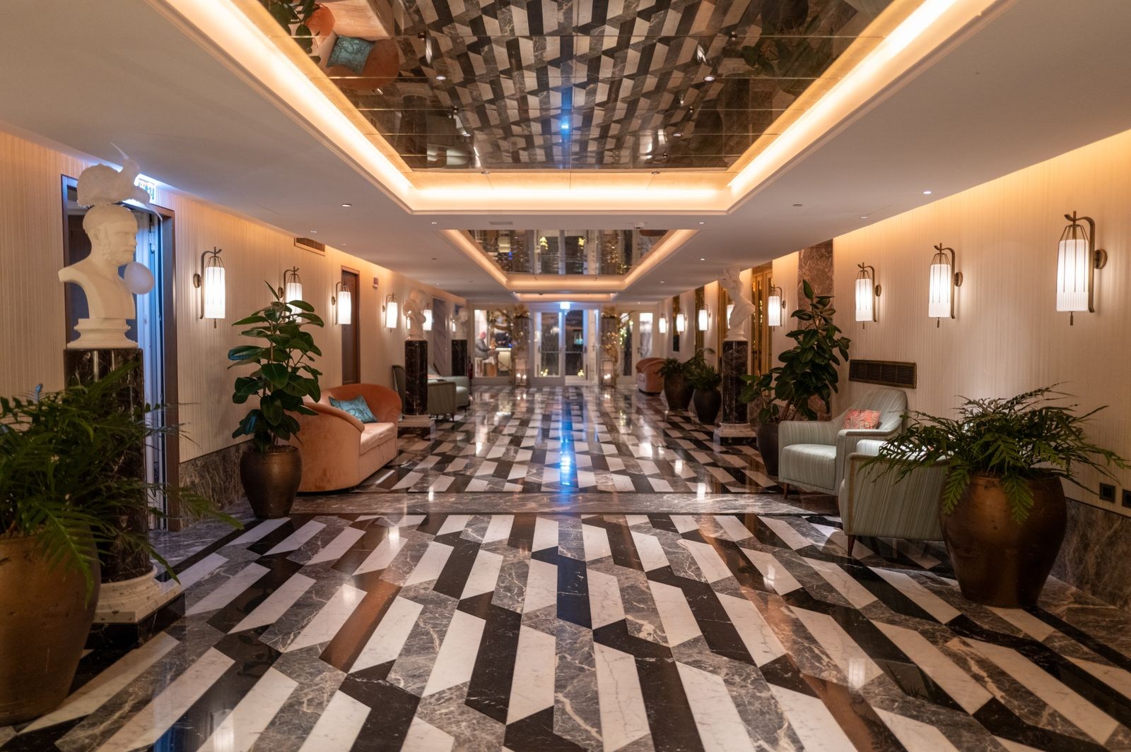 An elegant hotel lobby with marble flooring.
