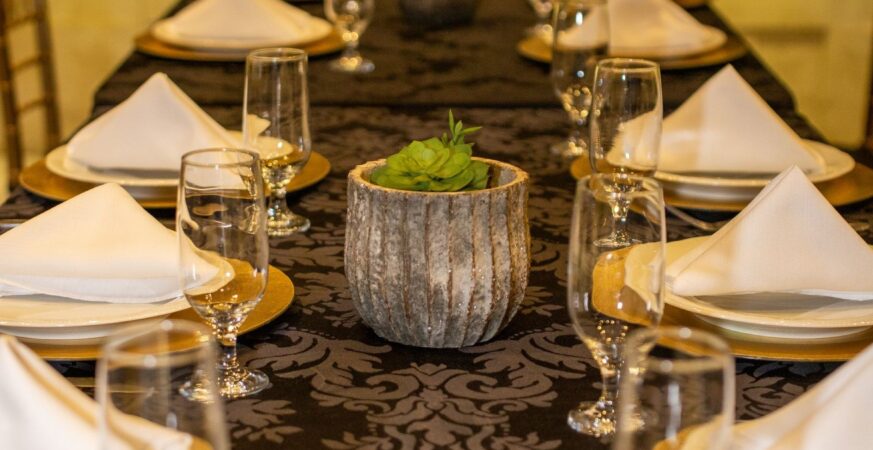 A table prepared for dinner in an elegant restaurant.