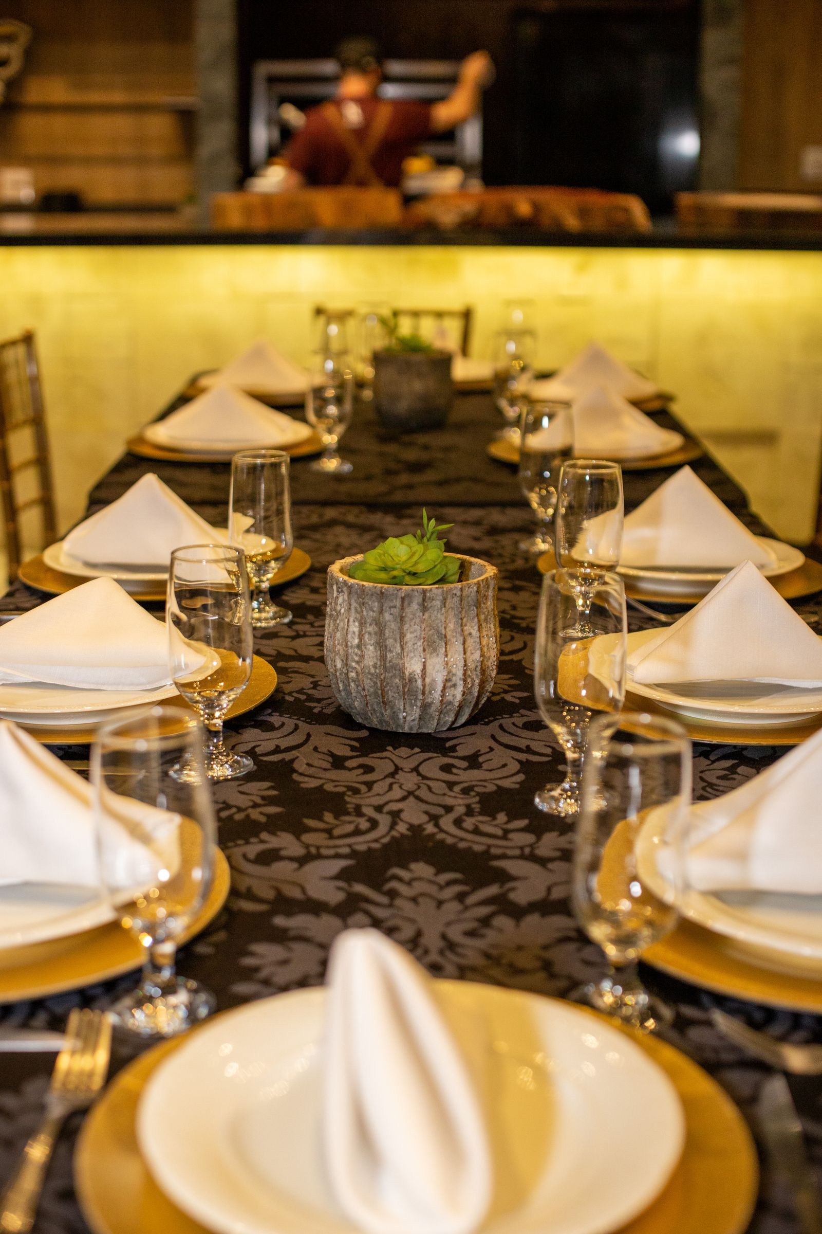A table prepared for dinner in an elegant restaurant.