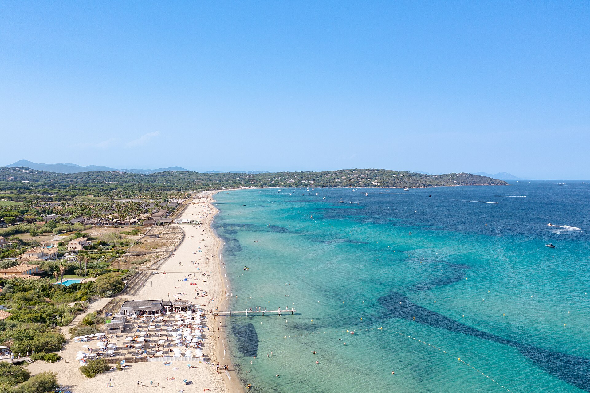 Aerial view of turquoise water and the shoreline at Pampelonne Beach on the French Riviera