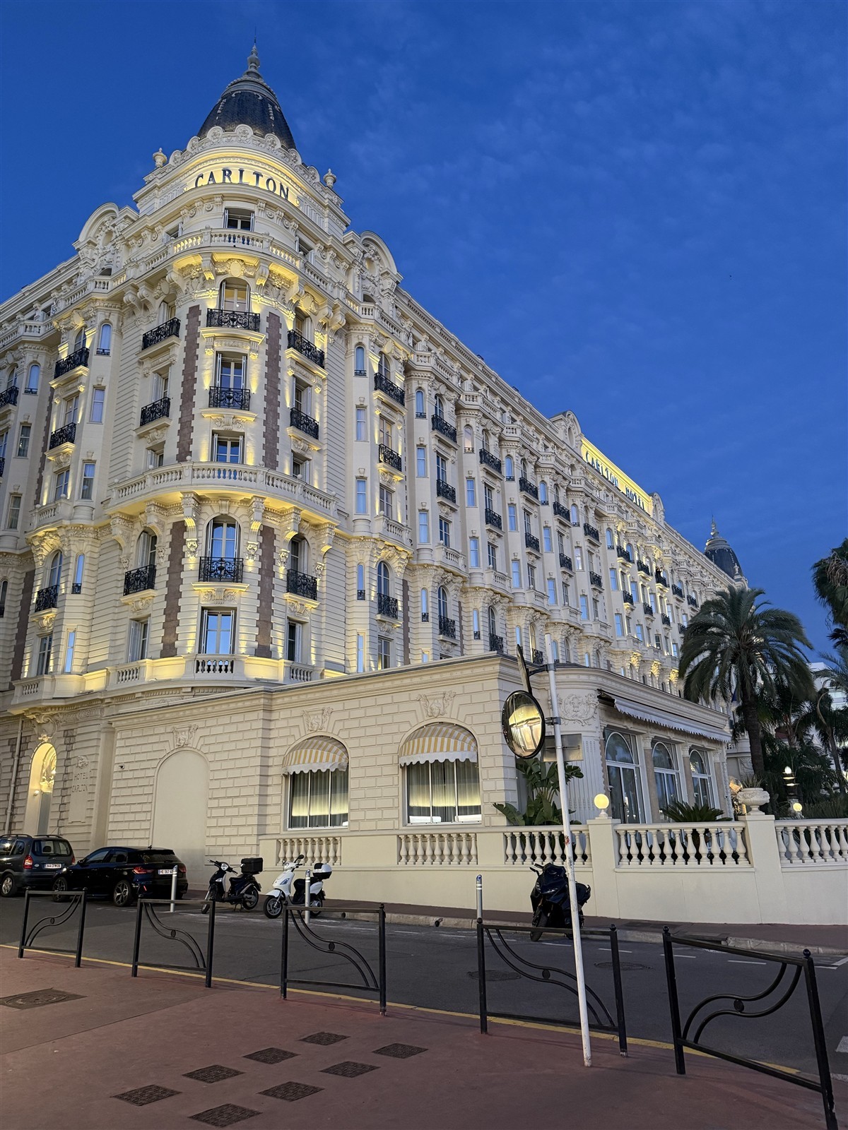 Illuminated facade of Carlton Cannes at dusk