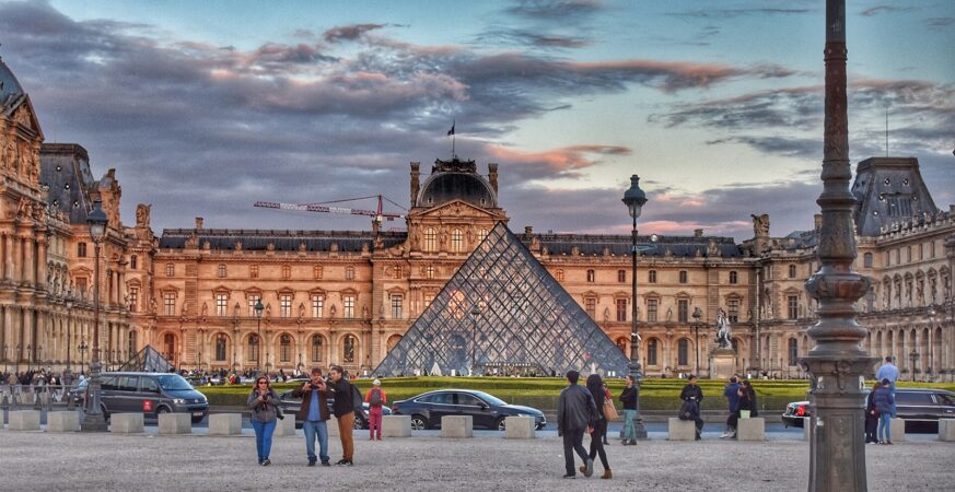 Louvre Pyramid and Cour Napoléon at sunset in Paris