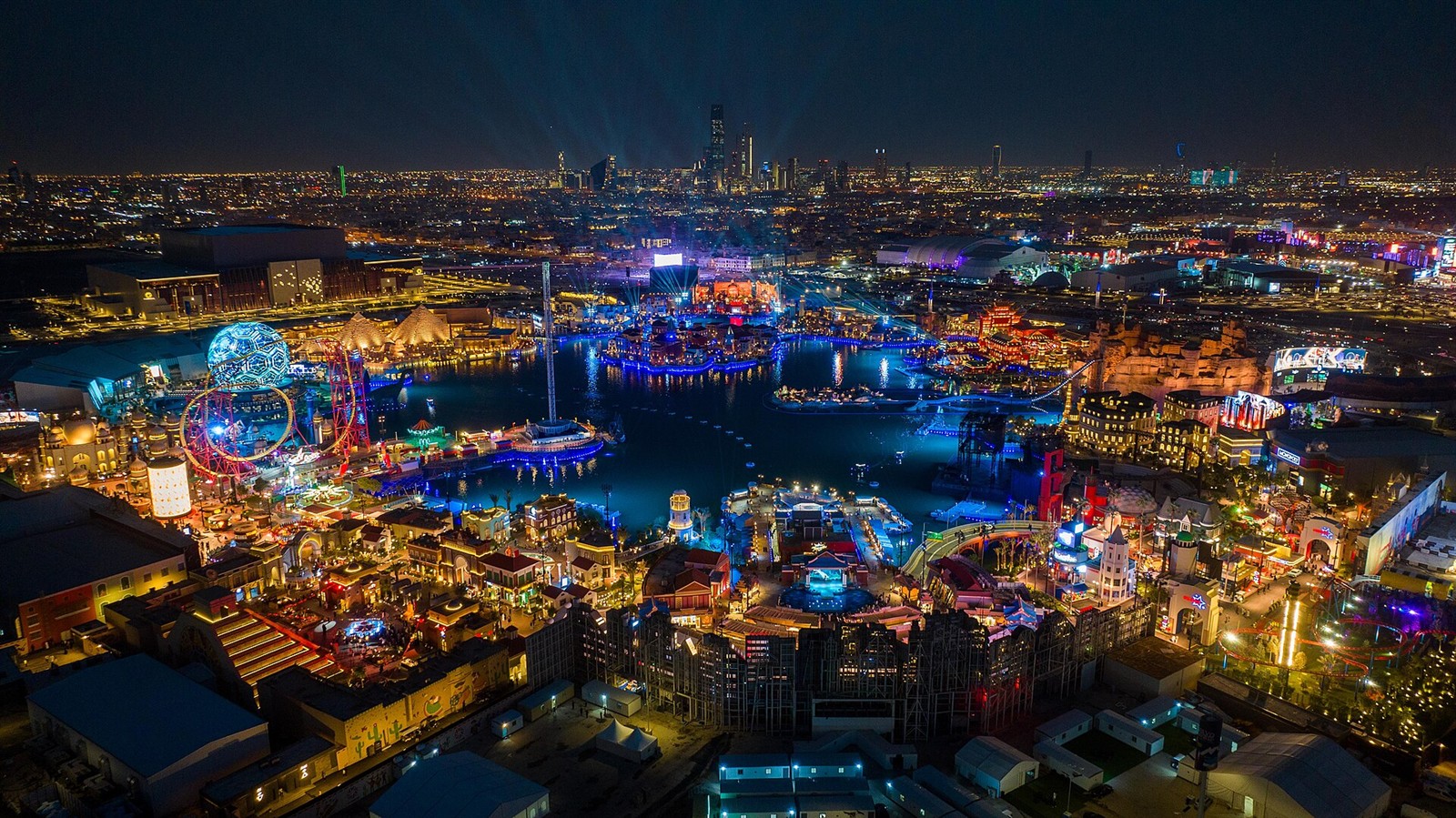 Illuminated lake and entertainment zones at Boulevard World in Riyadh at night