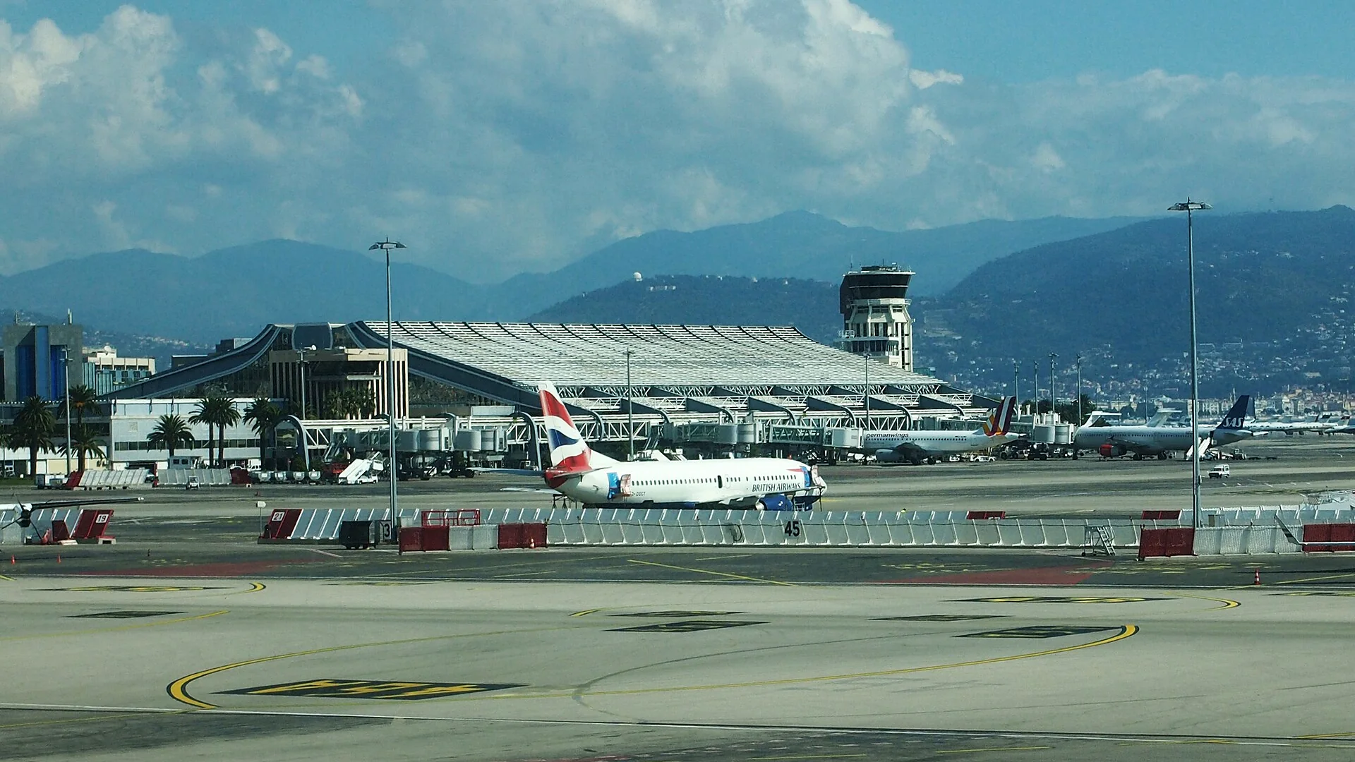 Terminal 1 at Nice Côte d'Azur Airport with the Alps in the background