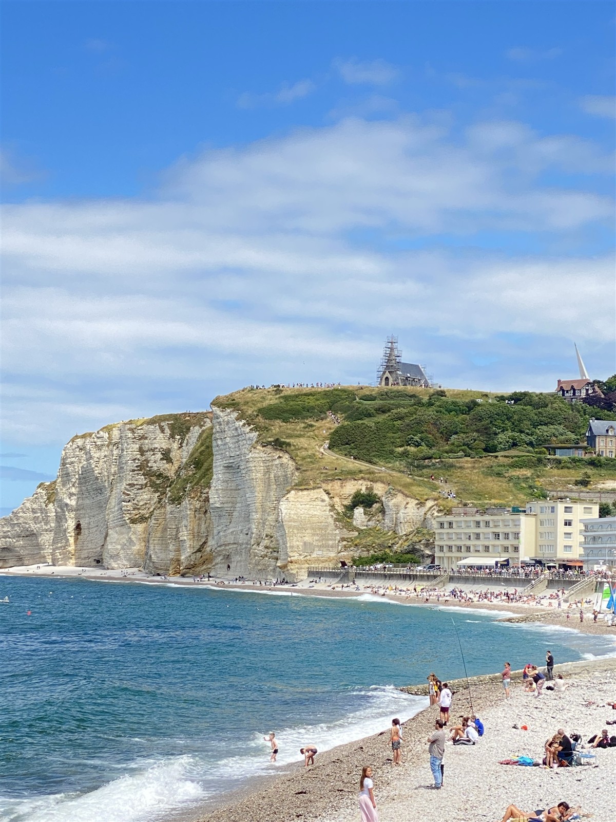 Étretat’s pebble beach, opposite cliff and waterfront, from the OUISTARS visit album.
