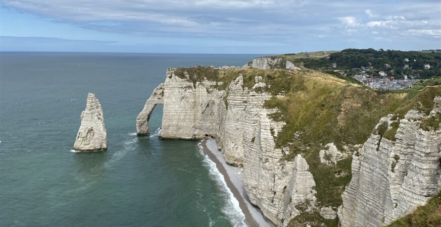 Étretat’s needle and arch with a seabird in the foreground, from the magazine’s Normandy visit.