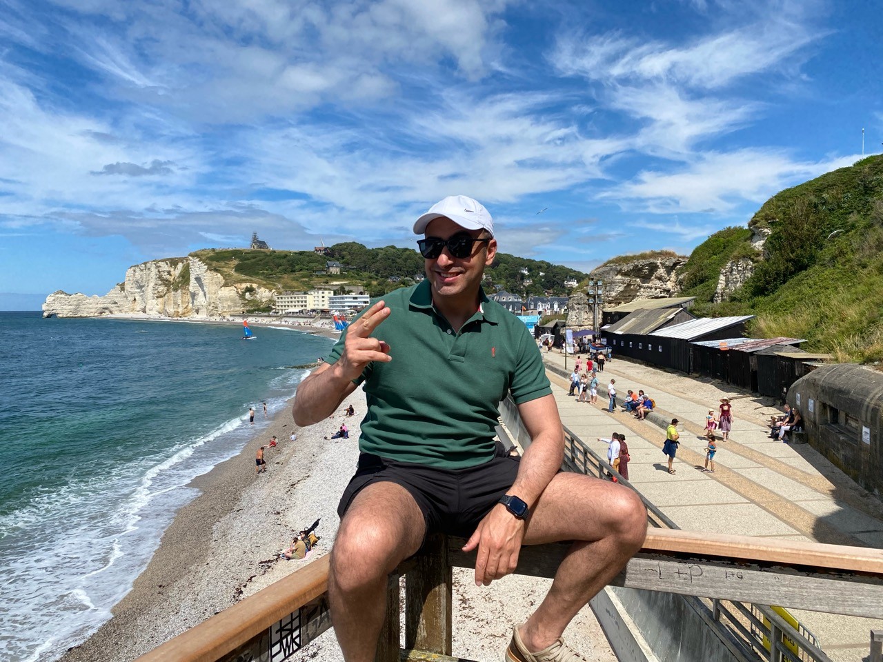 A souvenir photograph from the visit, with Étretat beach and promenade behind.