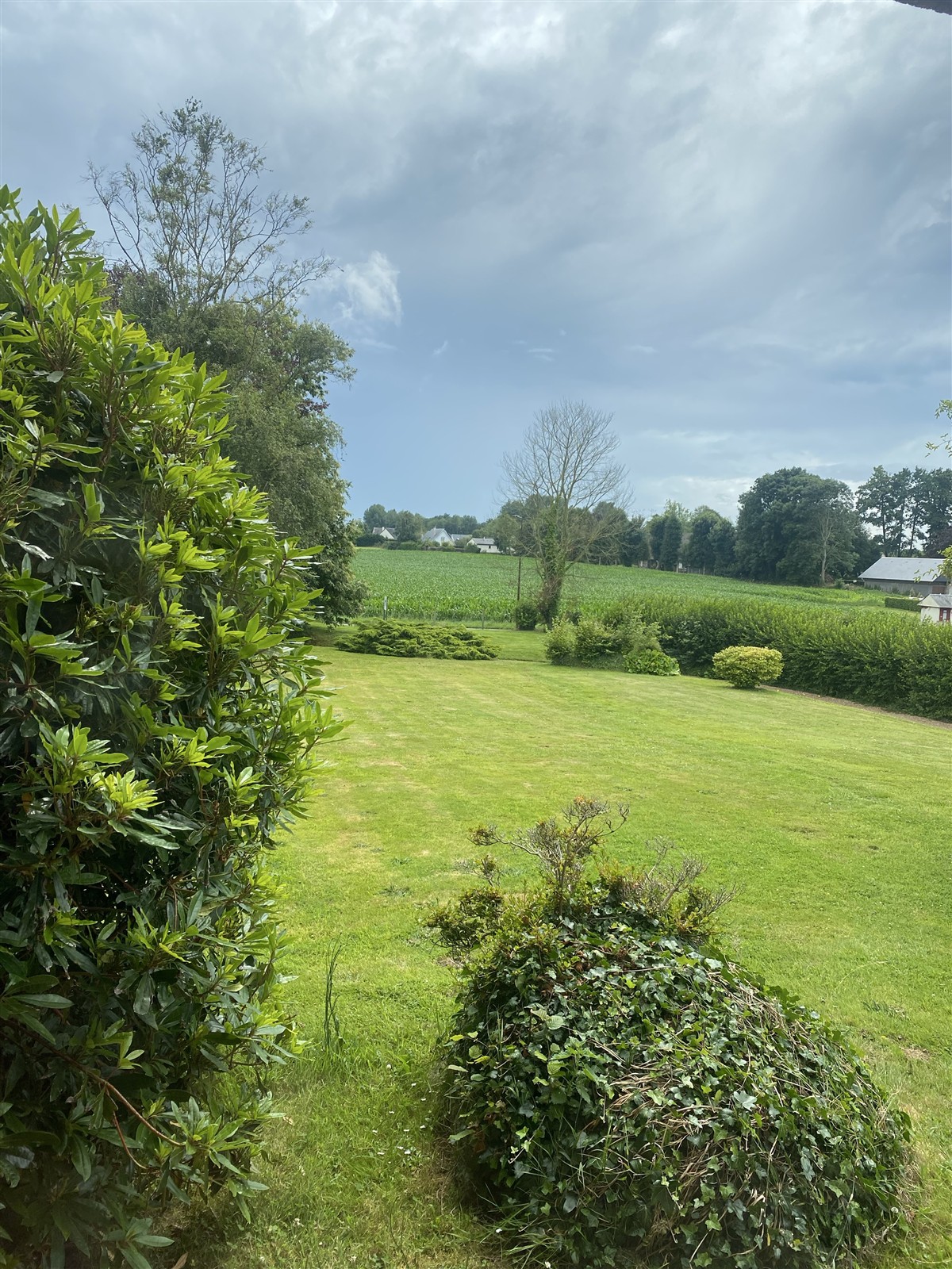 Garden, field and trees in the rural part of the Normandy visit album.