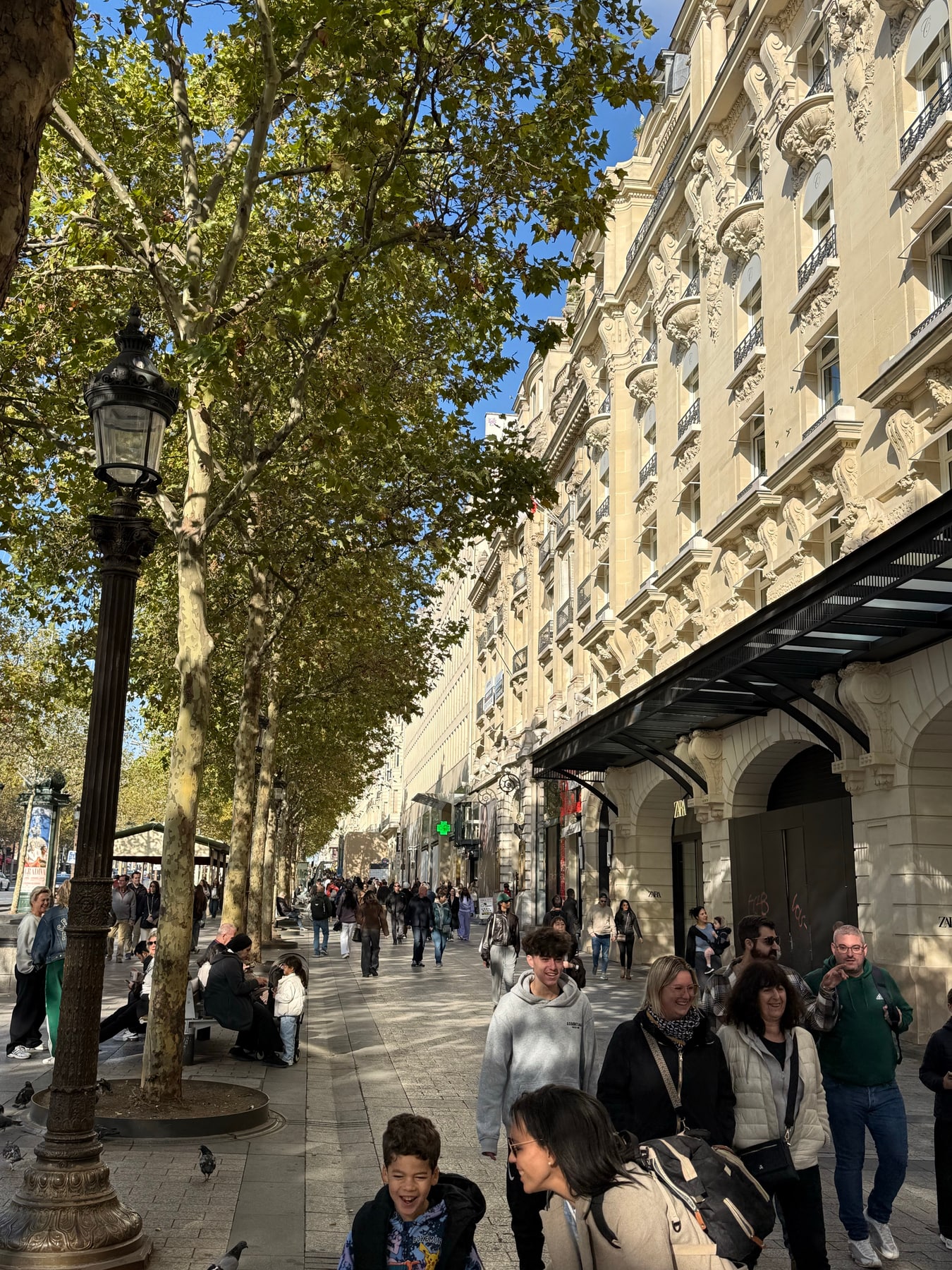 Field photograph 10 from the Champs-Élysées where pedestrians and visitors returned to the street in Paris on the morning of 18 October 2026