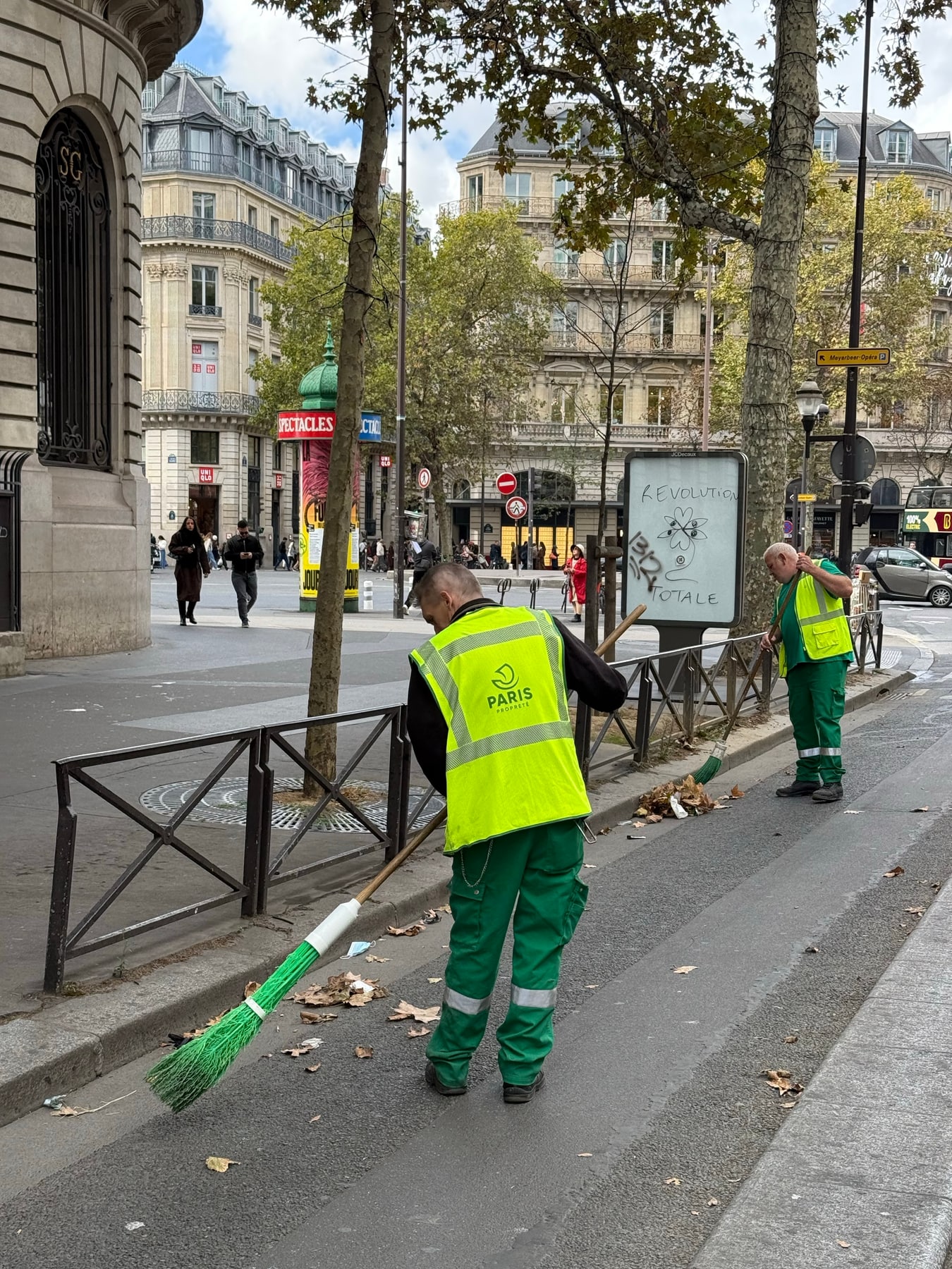 Two Paris street-cleaning workers restoring the street on 18 October 2026