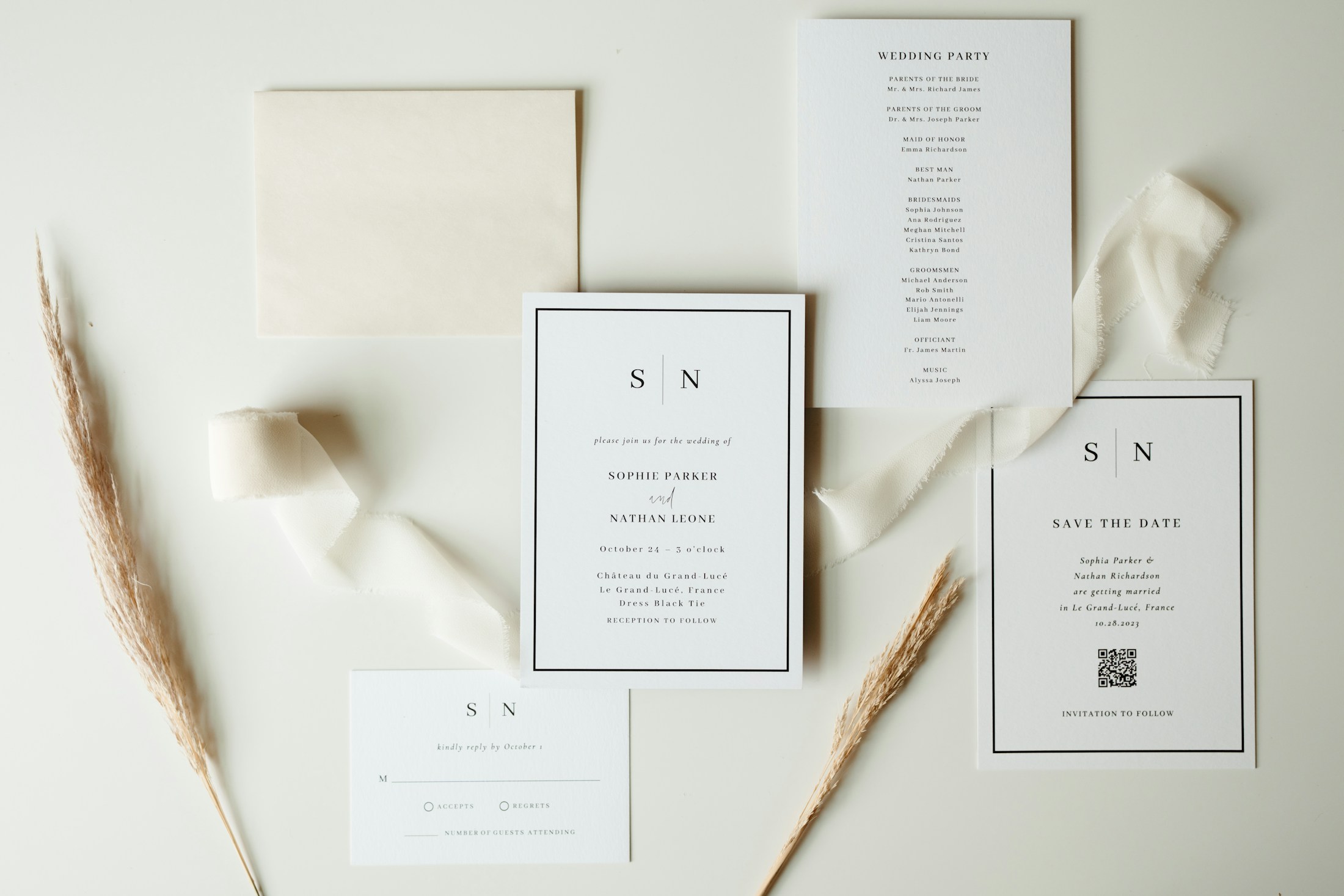 Wedding stationery arranged with neutral ribbons and printed details