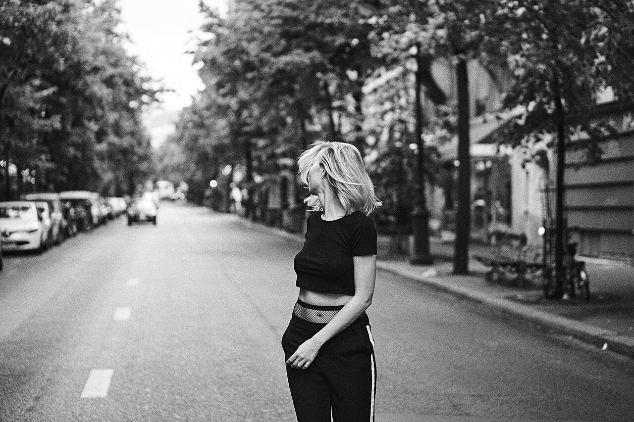 A woman walking independently along a Paris street