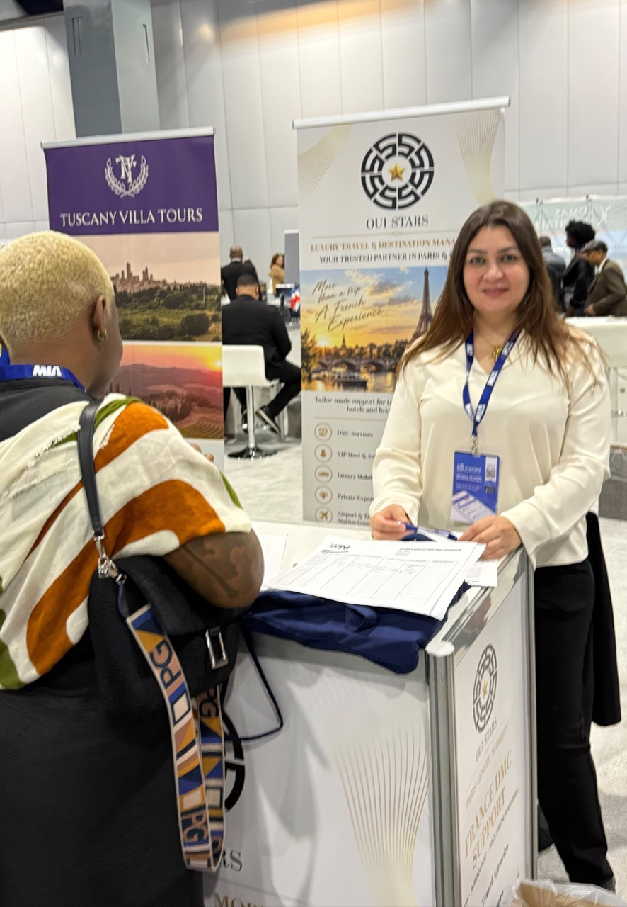 Welcoming visitors to the OUISTARS stand.
